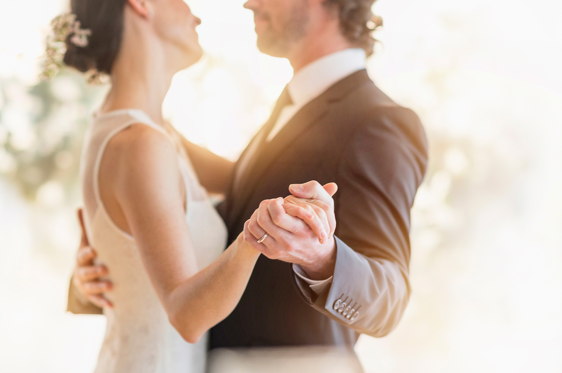 Bride and Groom holding hands dancing